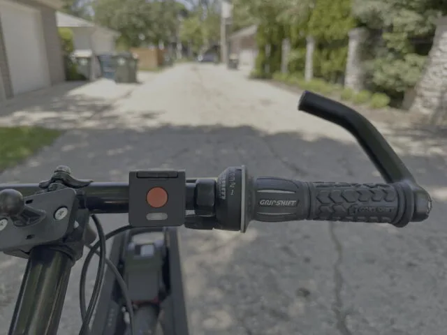 Turn almost any bike into an e-bike with the Clip 7 The Clip remote. Hold the red button down to go; the white button below will regenerate the battery.
